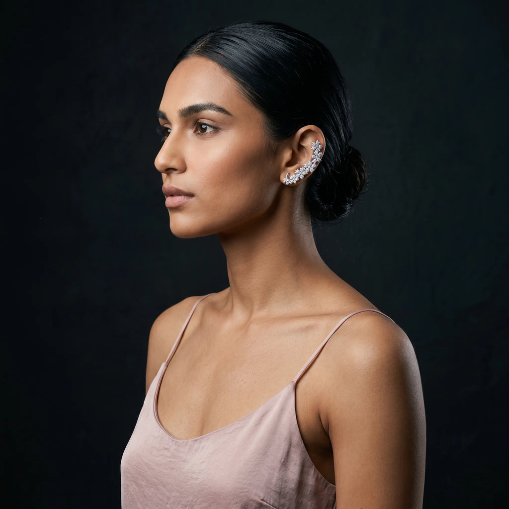 Indu silver floret ear climber side profile with sleek low bun and dusty rose silk strap