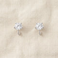 Tara silver-prong cubic zirconia solitaire stud earrings on cream linen — Aurum & Isle